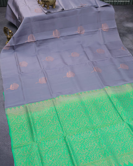 Roopam silk saree grey and green with copper zari woven floral buttas in borderless style