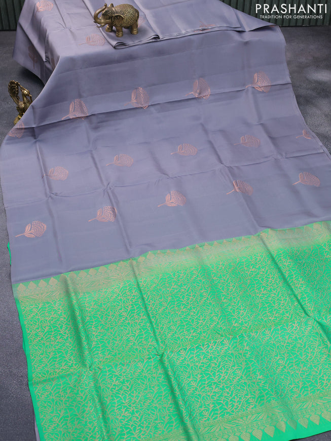 Roopam silk saree grey and green with copper zari woven floral buttas in borderless style