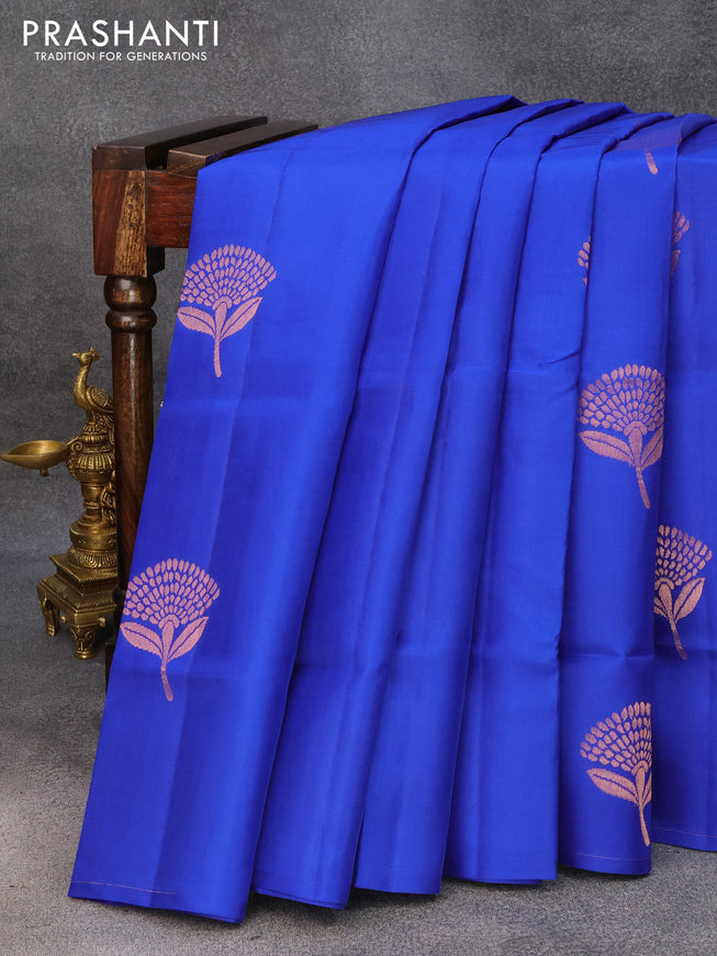 Roopam silk saree royal blue and bottle green with copper zari woven floral buttas in borderless style