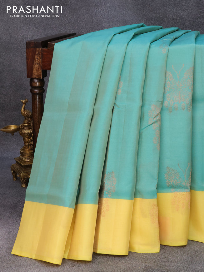 Roopam silk saree teal green and pale yellow with copper zari woven butterfly buttas and copper zari woven butta border