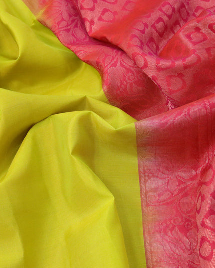 Roopam silk saree lime green and dual shade of pinkish orange with copper zari woven floral buttas in borderless style