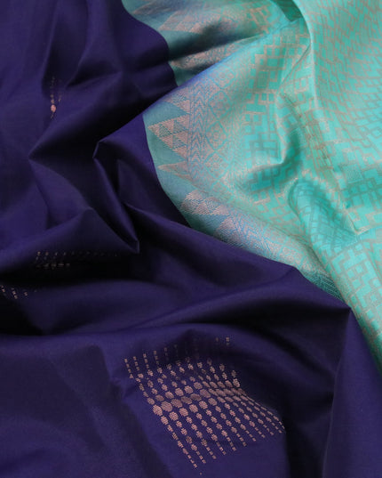 Roopam silk saree navy blue and teal blue with copper zari woven geometric buttas in borderless style