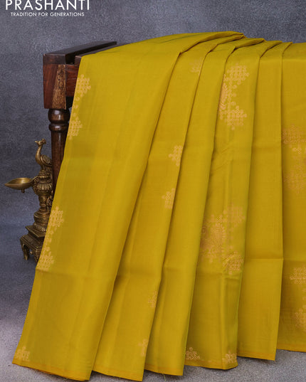 Roopam silk saree mustard yellow and dual shade of teal green with copper zari woven buttas in borderless style