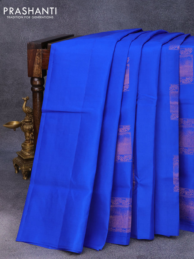 Roopam silk saree royal blue and baby pink with copper zari woven box type buttas in borderless style