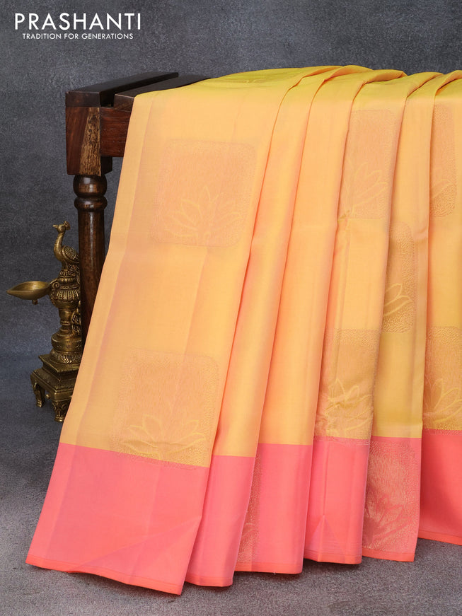Roopam silk saree dual shade of yellow and peach orange with copper zari woven buttas and copper zari woven butta border