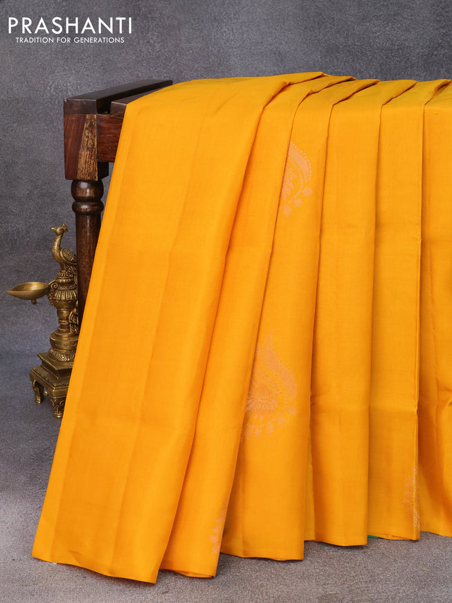 Roopam silk saree mustard yellow and dual shade of teal green with copper zari woven buttas in borderless style