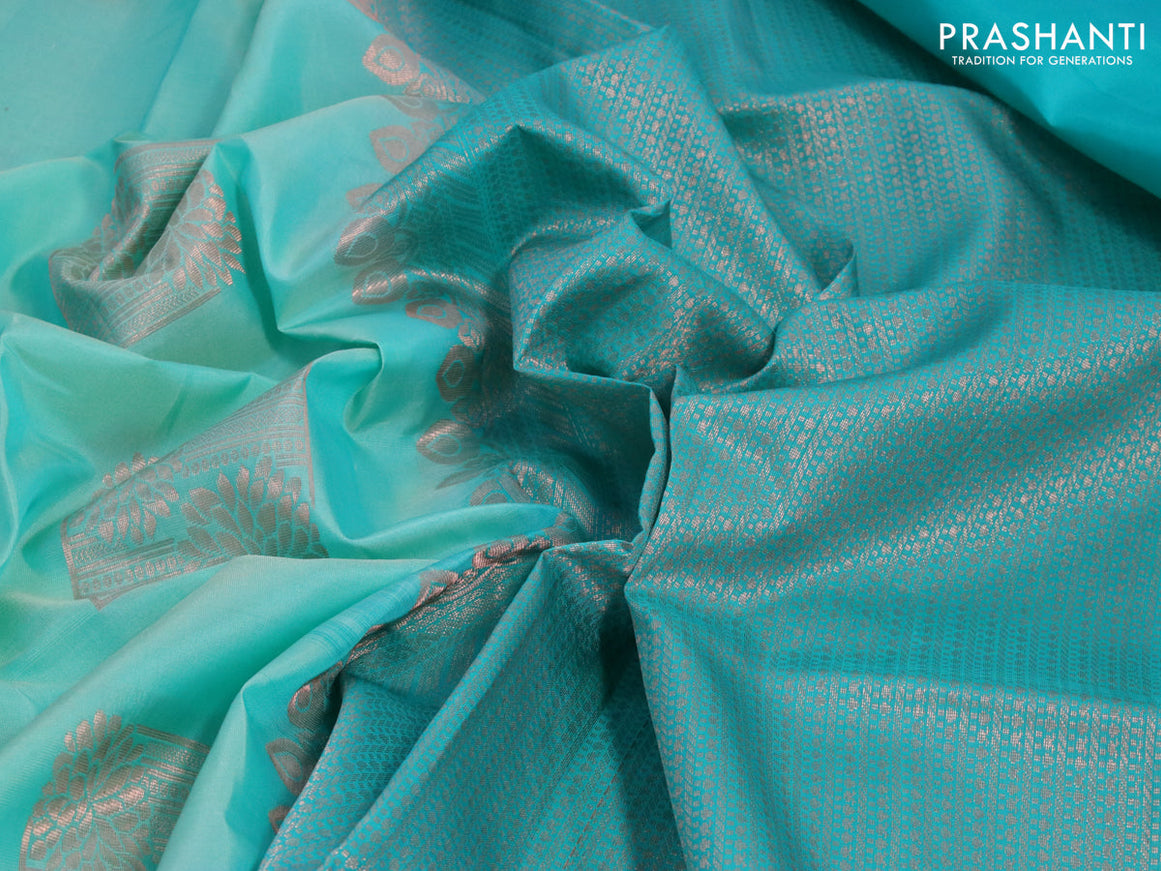 Roopam silk saree teal blue shade and teal blue with copper zari woven box type buttas and copper zari woven butta border