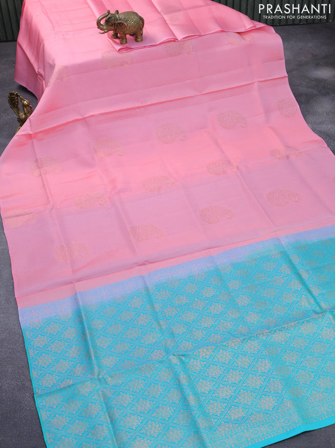 Roopam silk saree light pink and dual shade of teal blue with copper zari woven paisley buttas in borderless style