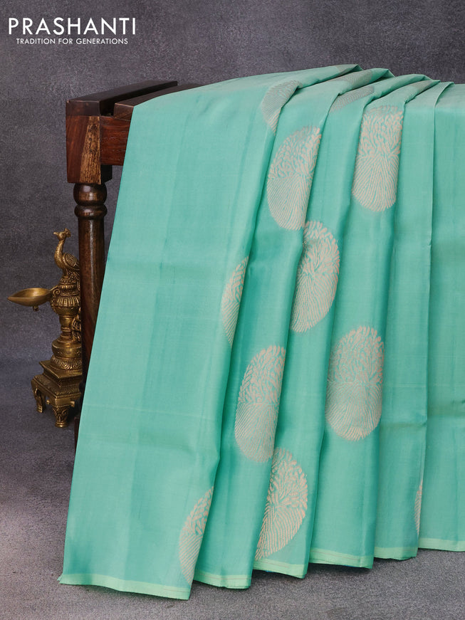 Roopam silk saree teal blue and light blue with copper zari woven paisley buttas in borderless style