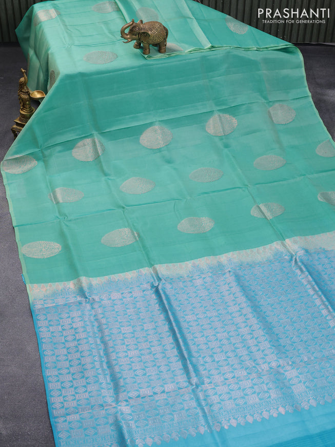Roopam silk saree teal blue and light blue with copper zari woven paisley buttas in borderless style