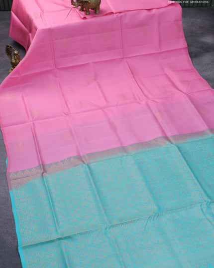 Roopam silk saree light pink and teal blue with copper zari woven buttas in borderless style