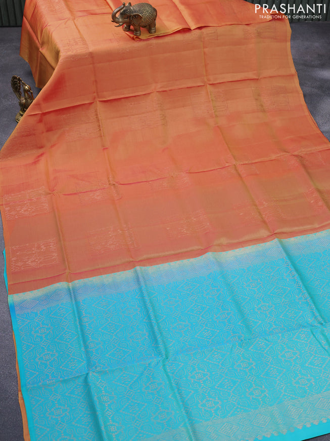 Roopam silk saree dual shade of yellowish pink and dual shade of teal blue with copper zari woven buttas in borderless style