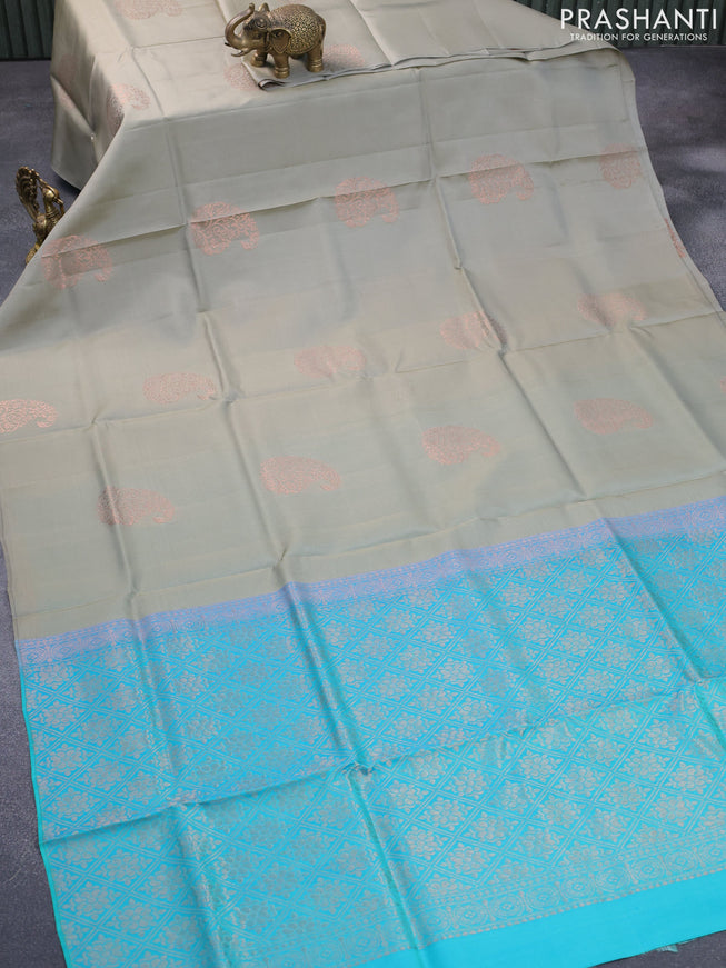 Roopam silk saree grey and dual shade of teal greenish blue with copper zari woven paisley buttas in borderless style