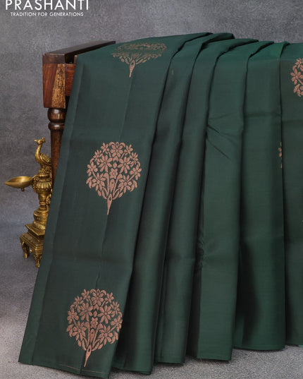 Roopam silk saree dark bottle green with copper zari woven buttas in borderless style