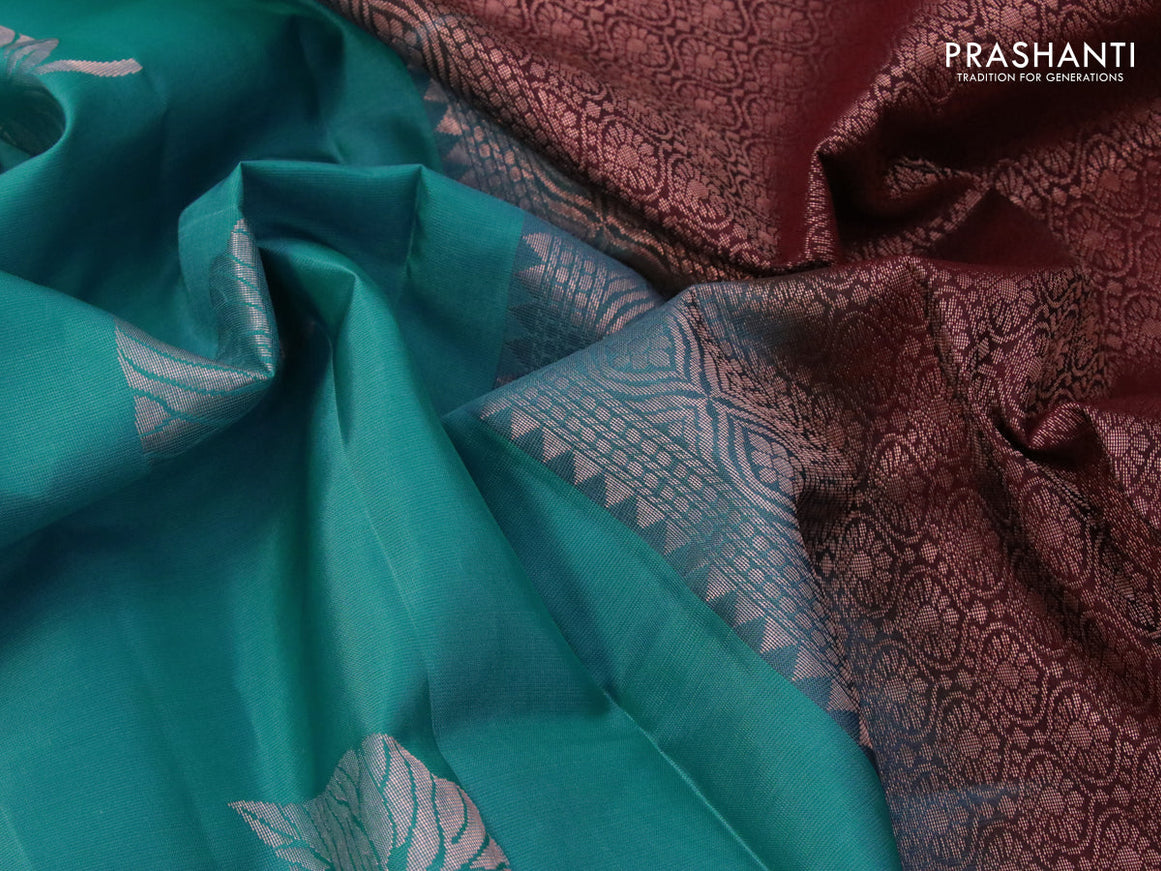 Roopam silk saree blue and deep maroon with copper zari woven leaf buttas in borderless style