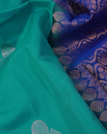 Roopam silk saree teal blue and blue with copper zari woven buttas in borderless style