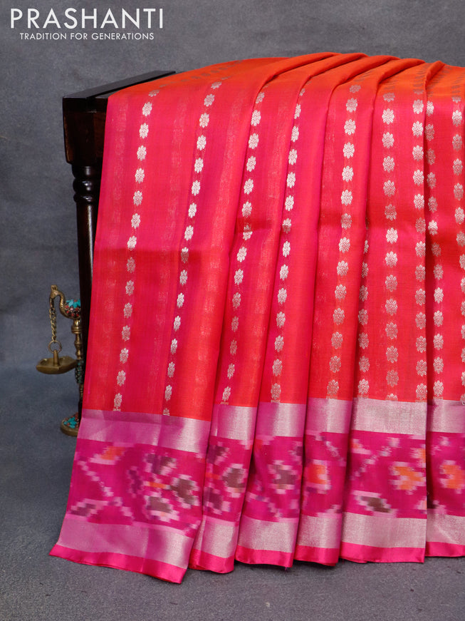 Pure uppada silk saree dual shade of pinkish orange and pink with allover silver zari woven floral buttas and silver zari woven ikat style border