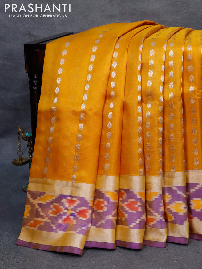 Pure uppada silk saree mustard yellow and blue with allover silver zari woven floral buttas and silver zari woven ikat style border