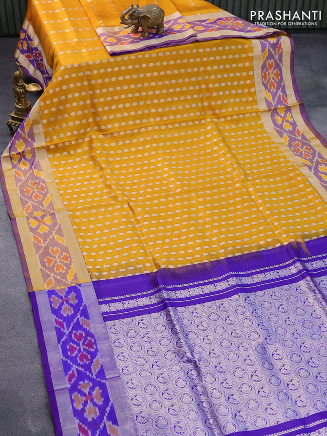 Pure uppada silk saree mustard yellow and blue with allover silver zari woven floral buttas and silver zari woven ikat style border