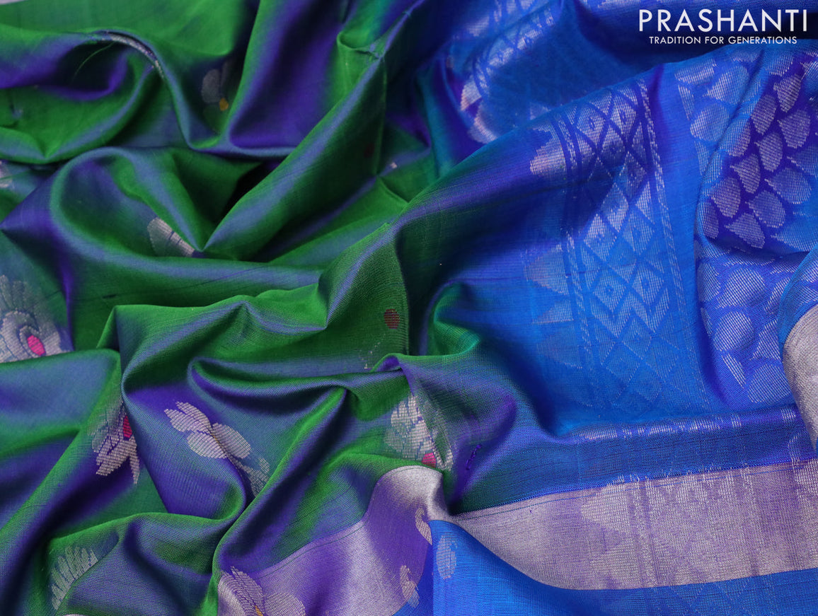 Pure uppada silk saree dual shade of bluish green and cs blue with silver zari woven buttas and silver zari woven butta border
