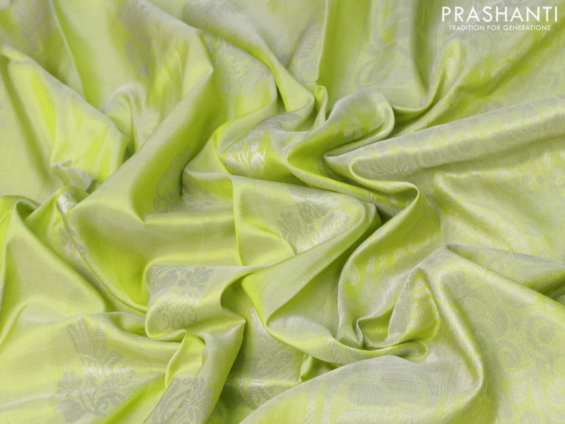 Pure uppada silk saree pista green with allover silver zari woven buttas and zari woven border