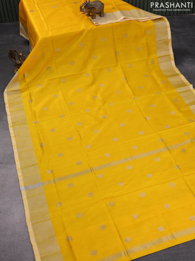 Pure uppada silk saree yellow with silver zari woven coin buttas and silver zari woven border
