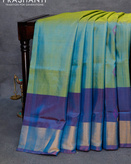 Pure uppada silk saree dual shade of greenish blue and dual shade of bluish maroon with thread & zari woven geometric buttas and zari woven border