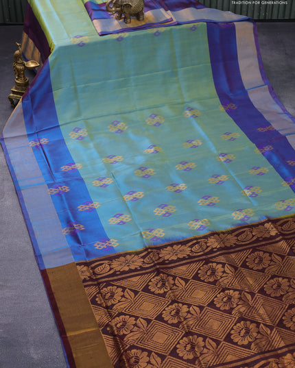 Pure uppada silk saree dual shade of greenish blue and dual shade of bluish maroon with thread & zari woven geometric buttas and zari woven border