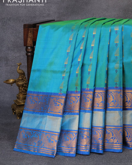 Pure uppada silk saree dual shade of bluish green and blue with allover thread & zari woven buttas and long peacock design zari woven border