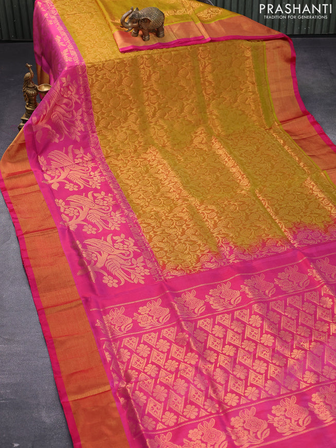 Pure uppada silk saree dual shade of mustard yellow and pink with allover peacock zari woven brocade weaves and long floral design zari woven border