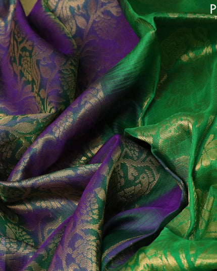 Pure uppada silk saree dual shade of greenish blue and green with allover peacock zari woven brocade weaves and long floral design zari woven border