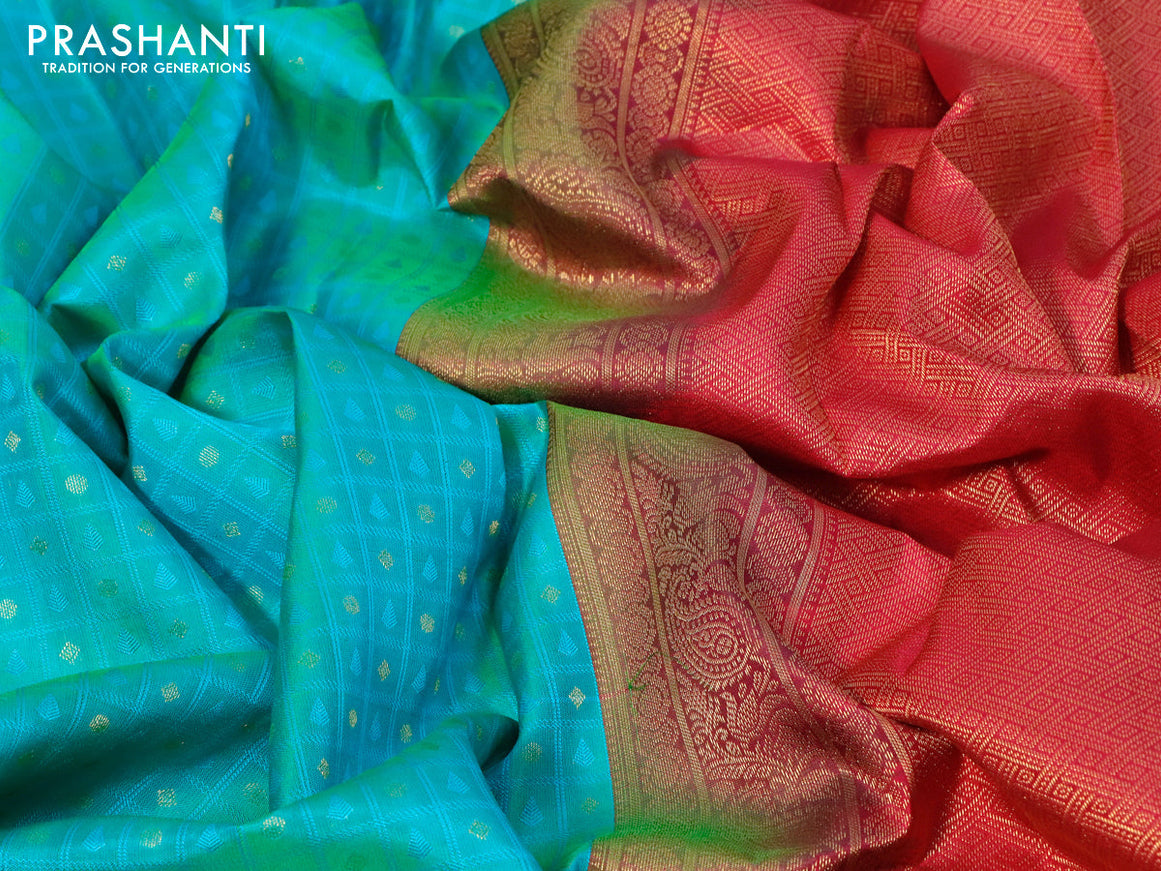 Pure kanjivaram silk saree dual shade of teal bluish green and pink with allover self emboss & zari buttas and paisley zari woven border