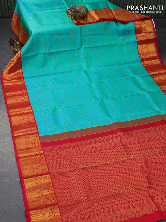 Pure kanjivaram silk saree dual shade of teal bluish green and red with allover zari woven 1000 buttas and zari woven korvai border