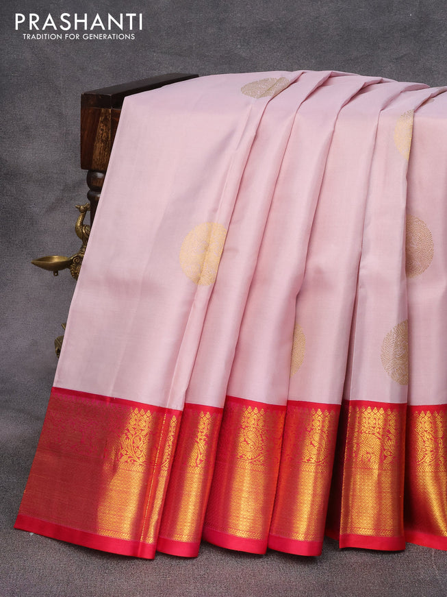 Pure kanjivaram silk saree pastel pink shade and dual shade of reddish pink with zari woven buttas and rich zari woven korvai border