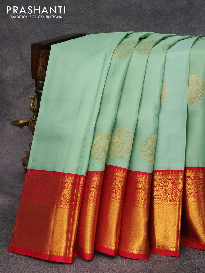 Pure kanjivaram silk saree pastel green and red with zari woven buttas and long floral zari woven korvai border