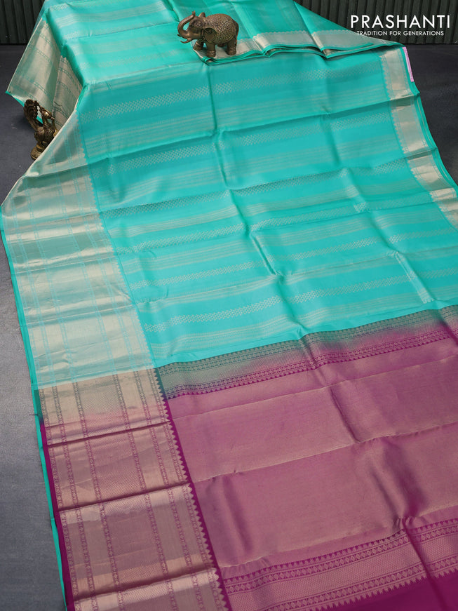 Pure kanjivaram silk saree teal green shade and purple with allover silver zari weaves and long zari woven border