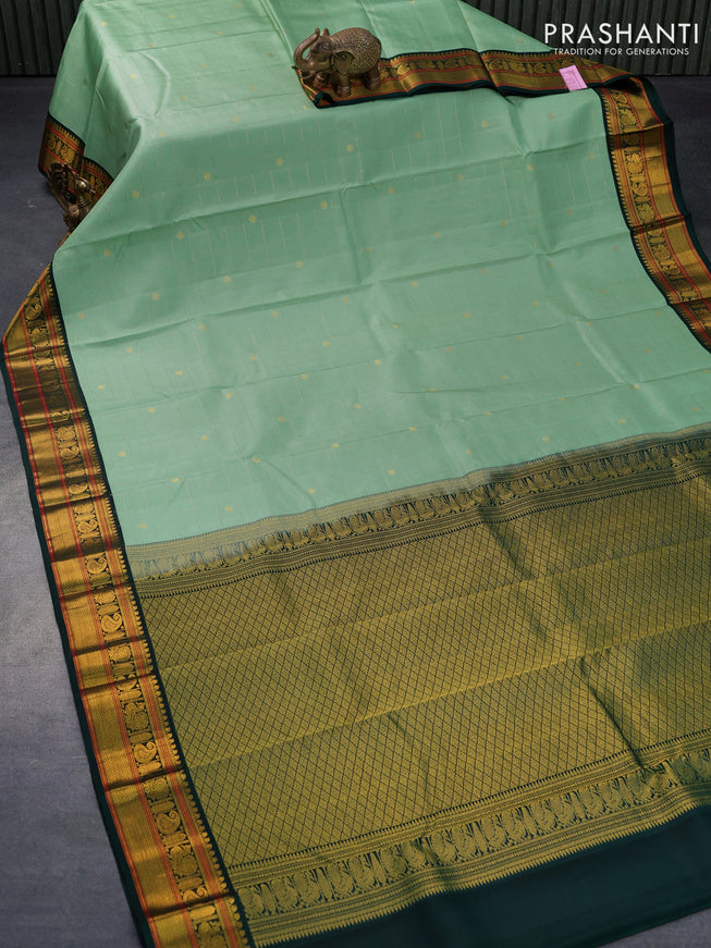 Pure kanjivaram silk saree pastel green and dark green with allover zari checks & buttas and annam zari woven korvai border