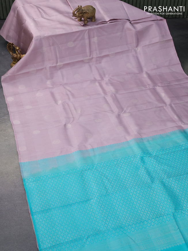 Pure kanjivaram silk saree pastel purple and teal blue with silver zari woven buttas in borderless style