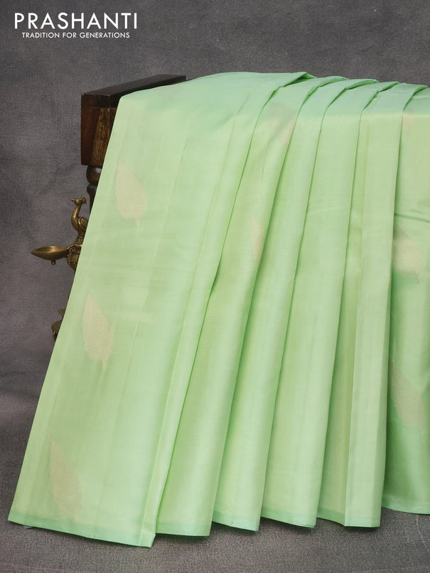 Pure kanjivaram silk saree pista green and cream with zari woven leaf buttas in borderless style
