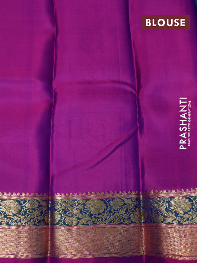 Pure kanjivaram silk saree dual shade of bluish green and purple with zari woven buttas and floral zari woven border