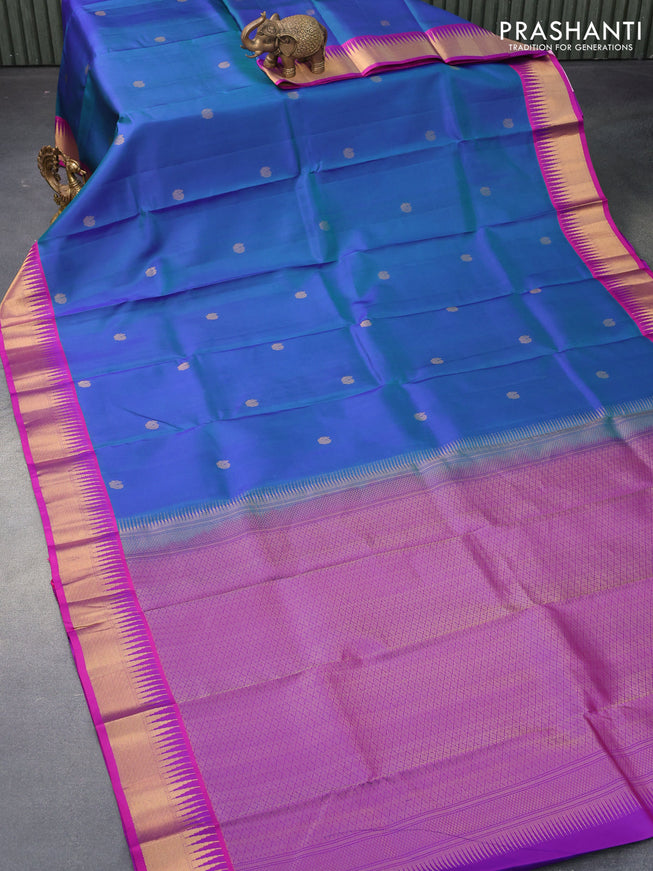 Pure kanjivaram silk saree dual shade of bluish green and purple with zari woven buttas and temple design zari woven border