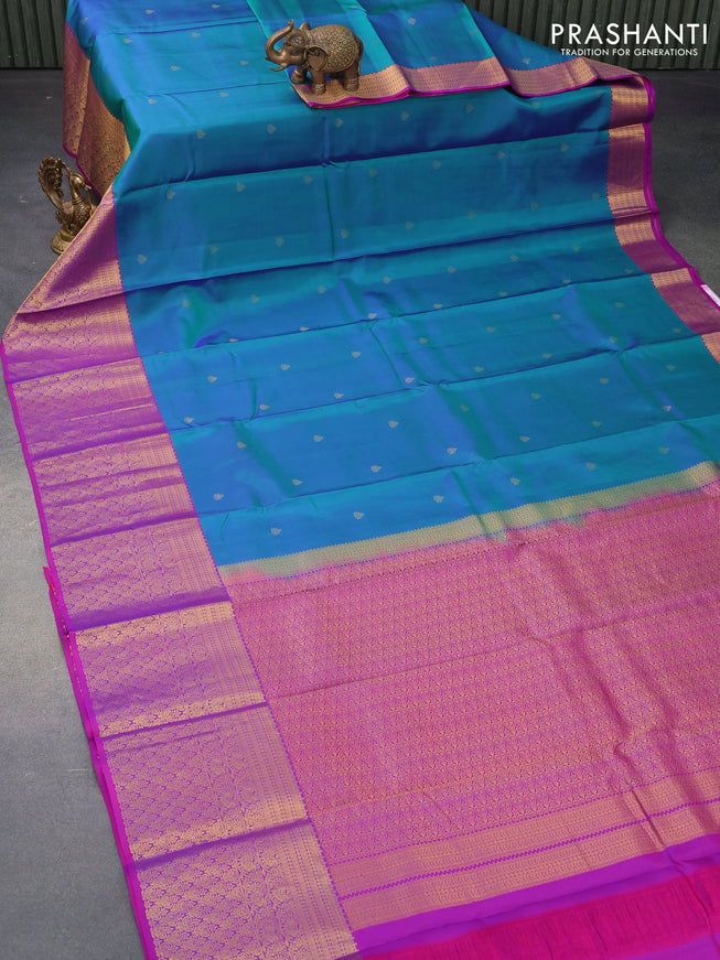 Pure kanjivaram silk saree dual shade of bluish green and purple with zari woven buttas and long zari woven border