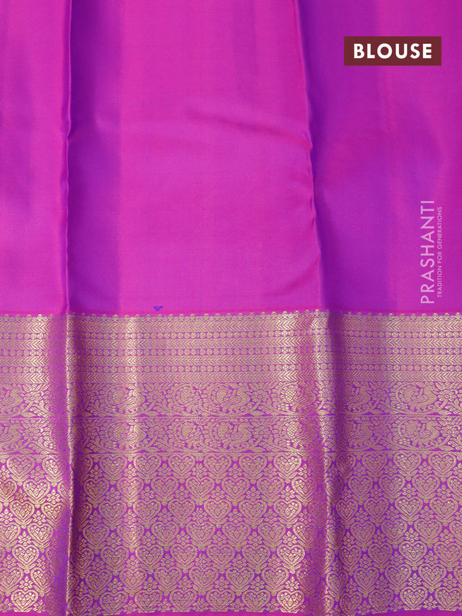 Pure kanjivaram silk saree dual shade of bluish green and purple with zari woven buttas and long zari woven border