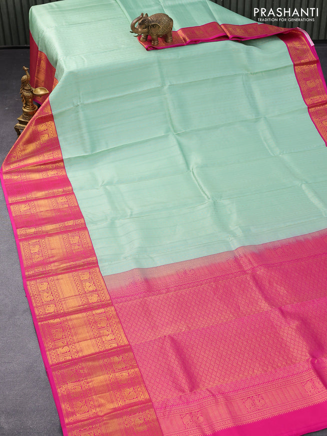 Pure kanjivaram silk saree pastel green and pink with allover zari weaves and long zari woven korvai border