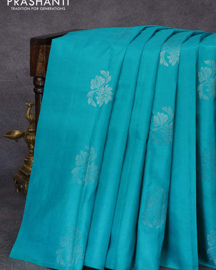 Pure kanjivaram silk saree teal blue and peach pink with silver zari woven buttas in borderless style