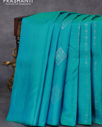 Pure kanjivaram silk saree teal blue and pastel brown with silver zari woven buttas in borderless style