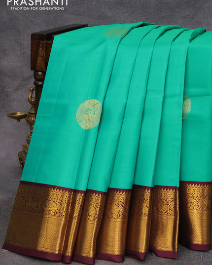 Pure kanjivaram silk saree teal green and wine shade with zari woven buttas and annam zari woven korvai border