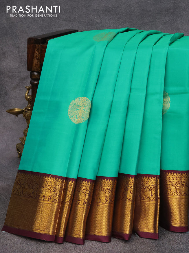 Pure kanjivaram silk saree teal green and wine shade with zari woven buttas and annam zari woven korvai border