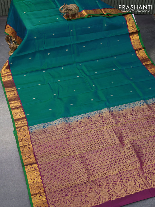 Pure kanjivaram silk saree teal blue and deep purple with zari woven buttas and annam zari woven korvai border