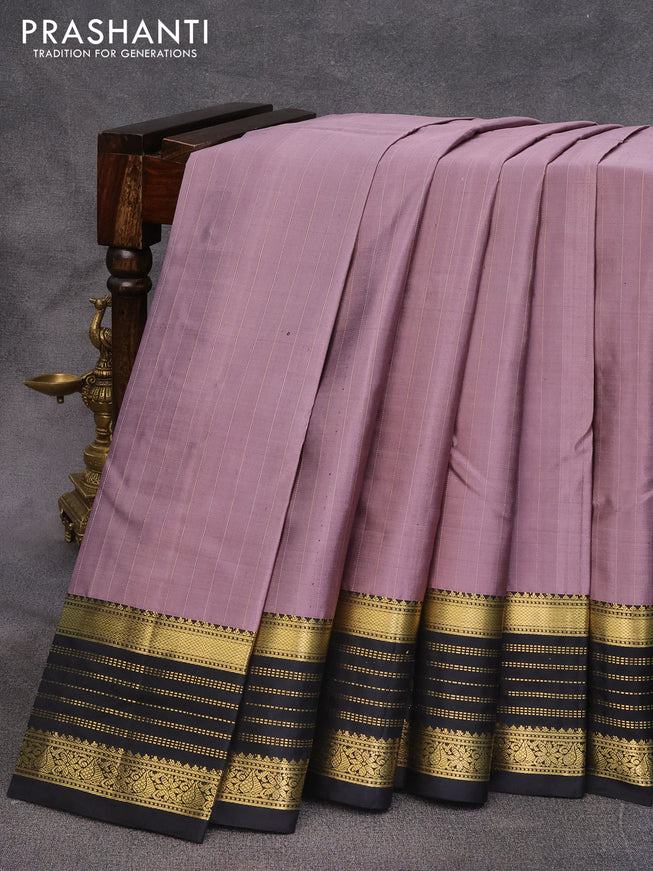 Pure kanjivaram silk saree pastel purple and black with allover zari stripes pattern and zari woven border